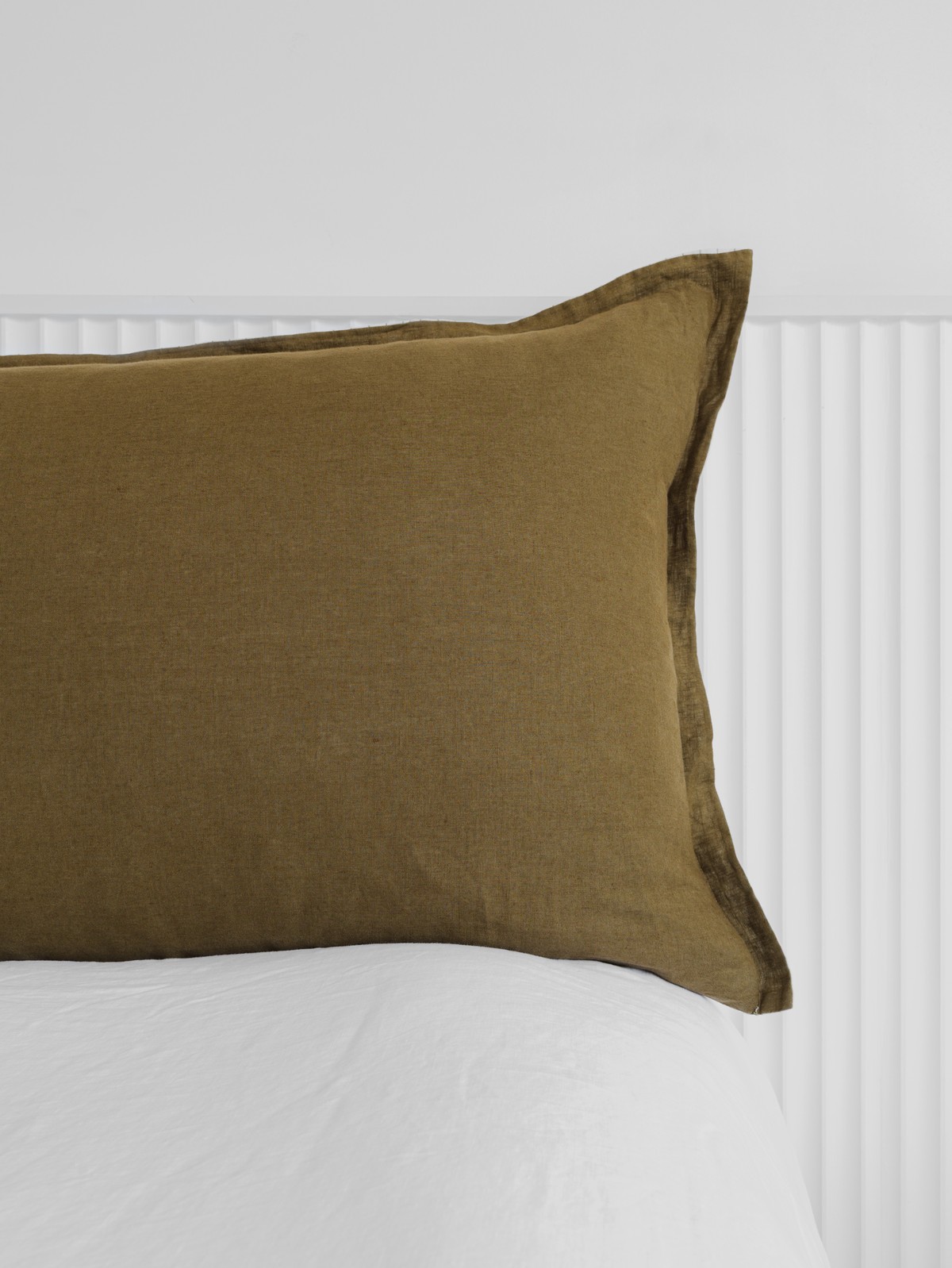 Olive Press bedhead cushion