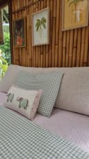 Bouclé bedhead cushion texture detail with checkered bedding