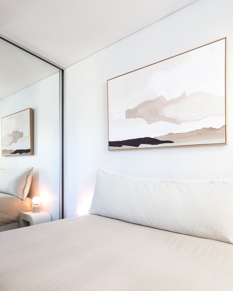 Minimalist bedroom with bedhead cushion