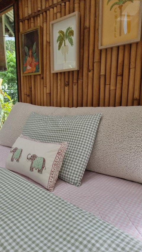 Bouclé bedhead cushion texture detail with checkered bedding